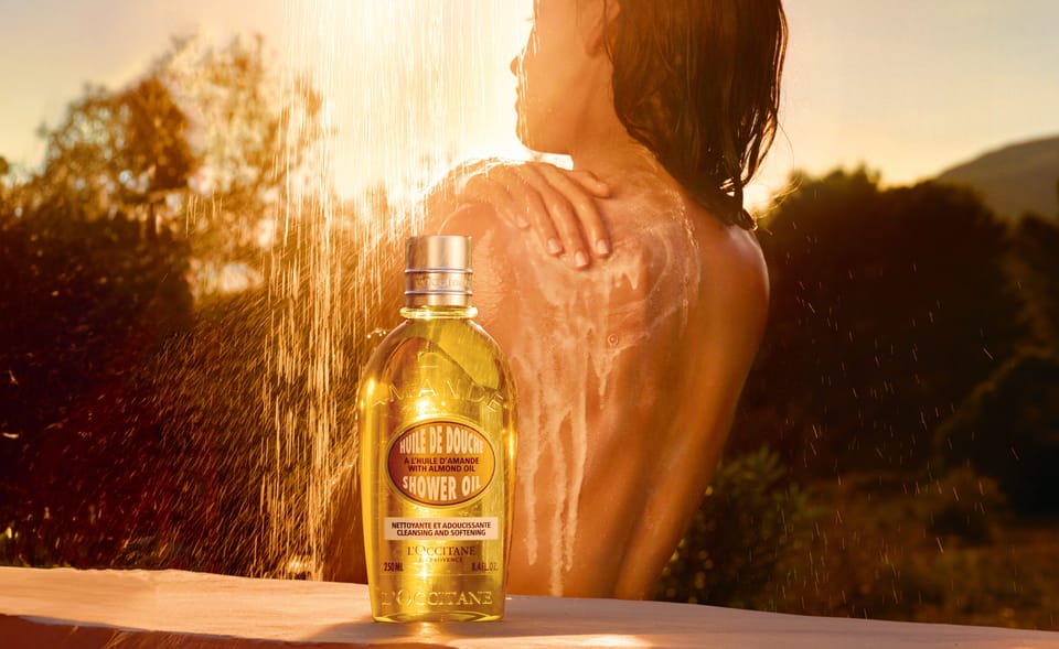 model in shower with l'occitane shower oil
